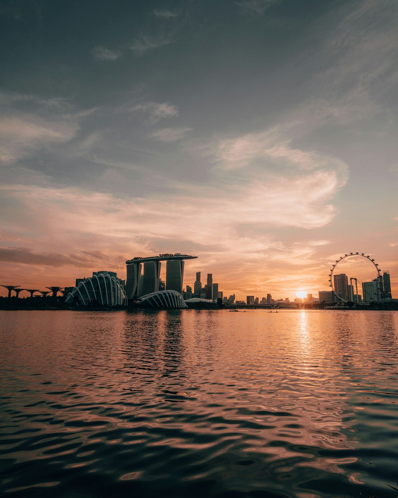 Singapore skyline across the water at sunrise